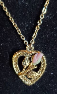 "Famous 1928 brand set of matching jewelry with a locket necklace, pierced earrings and bar pin.   Gold tone filigree with small pink rose and rose buds.  Necklace has a 16\" chain with a heart shaped locket that is about 3/4\" long.  Pin is 1 1/4\" long and the earrings are 1/2\".  Please take a look at all the pictures." Collectible Heart-shaped Hallmarked Jewelry, Vintage Charm Jewelry For Valentine's Day, Rose-colored Jewelry For Valentine's Day Anniversary, Victorian Jewelry With Hallmark For Valentine's Day, Antique Hallmark Jewelry For Valentine's Day, Dainty Vintage Charm Jewelry For Valentine's Day, Collectible Heart-shaped Jewelry For Valentine's Day, Valentine's Day Heart Charm Jewelry Collectible, Valentine's Day Collectible Jewelry With Heart Charm