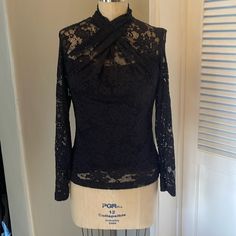 Elie Tahari Lace Top Szs Black Long Sleeves Lined. Draped Neckline. Three Buttons At Back Neckline. 2 Are Missing. 1 Is Attached To Shirt. One Extra Button In Bag. Measurements Are: Pit2pit 19” Waist 15” Hip 18” Length 24” Elegant Stretch Lace Top For Night Out, Fitted Black Lace Top For Evening, Elegant Black Lace Top For Date Night, Fitted Black Lace Top For Formal Occasions, Black Lace Formal Tops, Stretch Lace Top, Black Silk Blouse, Lavender Silk, Draped Neckline