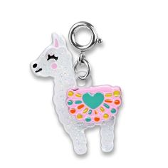 a white llama with a heart on it's back is shown in the shape of a keychain