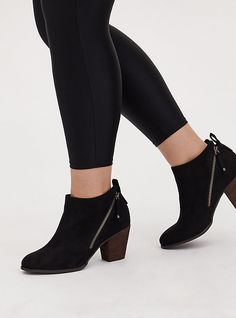 Versatile, this faux suede bootie will be your go-to because it has goes-with-everything appeal.     Our unique fit gives you extra wide width and extra room around your whole foot. EXTRA WIDE WIDTH (WW). Almond toe. Dual zippers. 2. 5” stacked heel. Extra cushioned footbed; textured outsole. Man-made materials. Imported extra wide width shoes. The best plus size women's black faux suede double zip bootie (ww) booties in black. Rock your look from Torrid to Festivals like Coachella and Black Bike, Unique Fits, Wide Width Shoes, Western Booties, Platform Heels Chunky, Black Rock, Wooden Heel, Extra Room, Suede Booties