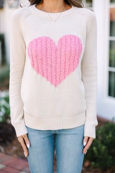 This sweater is here for all of your love! That knit heart is so cute! This sweater is absolutely perfect for Valentine's Day but we think it will also be perfect for any day of the week! Round neckline Long sleeves Cable knit heart Generous stretch Sydney is wearing the small. Cute Crew Neck Knit Sweater, Cute Winter Sweater With Heart Graphic, Cute Heart Graphic Sweater For Winter, Cute Heart Graphic Sweater For Fall, Pink Knit Sweater With Heart Print, Cute Winter Sweater With Heart Print, Cute Heart Print Winter Sweater, Cute Cream Soft Knit Sweater, Winter Sweater With Heart Graphic