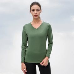 Fall Sports V-neck Tops, Athleisure V-neck Tops For Fall, Fall V-neck Athleisure Tops, Solid V-neck Athleisure Top, Sporty V-neck T-shirt For Fall, Solid Color V-neck Athleisure Top, Green V-neck T-shirt For Fall, Athleisure V-neck T-shirt In Solid Color, T Shirt Vest