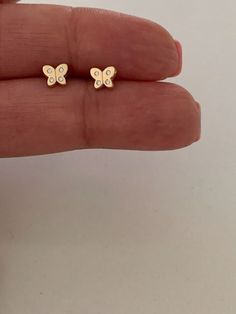 "14k Gold Butterfly Earrings, Cubic Zirconia Dainty Gold Butterfly Stud, Butterflies, Earrings, Tiny Earrings, Studs, Minimal Earrings, 6x5MM ♦ Materials: 14K Gold and Cubic Zirconia ♦ Available colors: Yellow Gold  ♦ Closure: Screw Backs ♦ Earrings Measurements: 6x5 (HxW) Millimeters, these earrings dainty, delicate and beautiful  ----------------------------------------------------------------------------------------------- US Size Guide: These are the sizes of U.S coins to compare with: Dime: Cute Gold Earrings For Mother's Day, Yellow Gold Birthstone Earrings For Birthday, Small Gold Cute Earrings, Cute Gold Butterfly Jewelry, Gold Earrings With Diamond Accents As A Gift, 14k Gold Butterfly Earrings For Gift, Butterfly-shaped Yellow Gold Earrings For Anniversary, Gold Cubic Zirconia Earrings For Mother's Day, Yellow Gold Butterfly Earrings For Anniversary