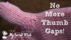 a pink sweater with the words, no more thumb gaps