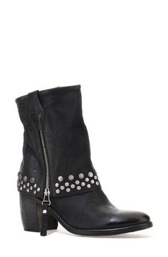 Double-down on contemporary Western styling in this leather boot designed with a dual zip closures and a fold-over-look shaft dotted with studs around the arch-grazing cuff. 3 1/2" heel; 1/2" platform 7 1/4" shaft Dual side-zip closures Leather upper and lining/synthetic sole Imported Leather Moto Boots With Grommets For Fall, Rugged Moto Boots With Rivets For Fall, Biker Boots With Rivets For Fall, Punk Leather Moto Boots With Silver Studs, Winter Leather Boots With Silver Studs, Winter Leather Moto Boots With Studs, Leather Moto Boots With Studs For Winter, Leather Moto Boots With Spikes For Winter, Punk Leather Boots With Silver Studs