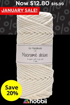 a roll of macrame deluxe in white on a black background