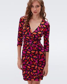 Cut from our signature silk jersey, this knee-length wrap dress has long sleeves, a V-neck collar, and true wrap closure. The fabric is a perfect weight and doesn't wrinkle, making it the ultimate year-round travel companion. Wrap Dress Dvf, Pink Jersey Dress, Silk Wrap Dress, Jersey Wrap Dress, Silk Wrap Dresses, Mid Length Skirts, Silk Wrap, Mid Dresses, Black Wrap Dress