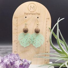 These monstera leaf earrings feature light green painted brass monstera leaf pendants measuring 34mm x 32mm dangling from 12mm brown acrylic beads with an interesting rope texture! The ear wires are made of hypoallergenic gold-plated surgical steel, making these earrings safe for sensitive ears! They measure approximately 2.5 inches from the top of the ear wires to the bottom of the pendant, and are very lightweight, weighing just 0.1 ounce each! Domestic shipping is always free here at Mayamade Nickel-free Adjustable Leaf-shaped Jewelry, Nickel-free Adjustable Leaf Jewelry, Adjustable Nickel-free Leaf-shaped Jewelry, Adjustable Green Drop Plug Earrings, Nature-inspired Green Jewelry For The Beach, Nature-inspired Green Jewelry For Beach, Green Leaf-shaped Earrings, Adjustable Leaf-shaped Earrings For Gift, Adjustable Leaf Shape Earrings For Gift