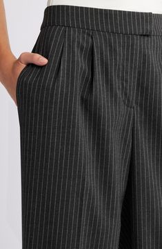 Crisp pleats structure these workday pants designed with leg-elongating vertical creases and wide legs. Zip fly with hook-and-bar closure Side-seam pockets; back welt pockets 65% polyester, 33% rayon, 2% spandex Machine wash, tumble dry Imported Pinstripe Wide Leg Pants For Work, Wide Leg Pinstripe Pants For Work, Pinstripe Wide-leg Workwear Pants, Pinstripe Wide-leg Pants For Workwear, Pinstripe Wide Leg Bottoms For Workwear, Pleated Wide Leg Pants, Pants Design, Wide Legs, Welt Pockets