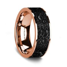 a wedding ring with black and rose gold inlays