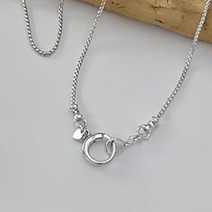 Solid 925 sterling silver rounded box chain, dainty 1.25mm width Solid Sterling Silver round push clasp, pendant clip, charm clip, 13mm width Shipping; Ships within one business day Free shipping in the USA Complimentary gift box with ribbon and wax seal stamp More items from my shop:  https://www.etsy.com/shop/LagunaLifeDesigns Silver Minimalist Snake Chain Charm Necklace, White Gold Charm Necklaces With Box Chain For Gift, White Gold Box Chain Charm Necklace For Gift, White Gold Charm Necklace With Box Chain As Gift, Minimalist Chain Necklace With Spring Ring Clasp As Gift, Minimalist Silver Charm Necklace With Box Chain, Silver Charm Necklace With Heart Pendant And Cable Chain, Silver Heart Pendant Charm Necklace On Cable Chain, Silver Heart Pendant Charm Necklace With Cable Chain