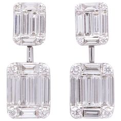 An AMAZING earring! 1.37 carats of round and special cut F color VS clarity diamonds give an illusion Emerald cut diamond look. Set in 18k white gold. The combination of the different cuts give these earrings a special sparkle. A wonderful gift -- longer earrings of the same design are available in our 1stDibs store. Approximately 0.60 inches in length. Emerald Cut Drop Earrings, Emerald Cut Diamond Earrings, Diamond Danglers, Gold Diamond Drop Earrings, Dangler Earrings, Fantasy Closet, Diamond Dangle Earrings, Emerald Cut Diamond, Diamond Drop Earrings