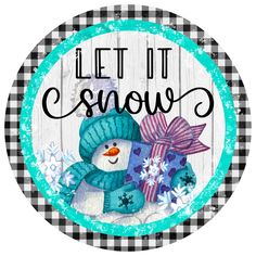 a snowman with a blue hat and scarf on it's head is in the center of a circular sign that says let it snow