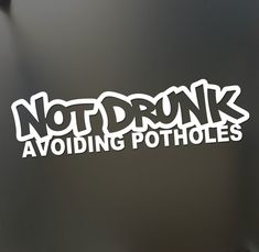 not drunk avoiding potholes sticker on the side of a refrigerator