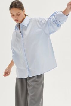 Evie Tie Back Poplin Shirt 100% COTTON -Button front placket -Poplin shirt -Tie back detail -Wide cuffed sleeve hem Model height is 5'9" wearing a small size S Tunic Tops Outfit, Tie Back Shirt, Cuffed Sleeve, Back Shirt, Out Back, Roll Up Sleeves, Light Blue Color, Online Tops, Poplin Shirt