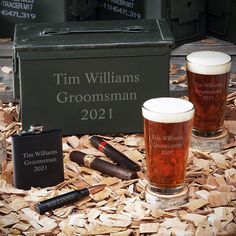 two glasses of beer next to some cigars and a box with the name tim williams groomsman on it