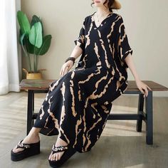 Sku CY-!124969 Material Cotton Style Bohemian Feature Printed Neckline V-neck Occasion Casual, Vintage, Stylish Seasons Spring, Summer Type Maxi Dress Color Black, Navy Size M, L, XL Size Chart: Please consult the size chart we provide for this item's measurements to help you decide which size to buy. Please note: There may be 1-3cm differ due to manual measurement. CM Bust Waist Length M 150 34 129 L 152 35 130 XL 154 36 131 Casual Printed V-neck Maxi Dress, Casual Black Short Sleeve V-neck Dress, Black V-neck Mini Dress For Vacation, Black Relaxed Fit Maxi Dress For Spring, Black Maxi Dress With Relaxed Fit For Spring, Casual Black Printed Maxi Dress, Black Printed Short Sleeve Maxi Dress, Black Printed Maxi Dress With Short Sleeves, Casual V-neck Printed Maxi Dress