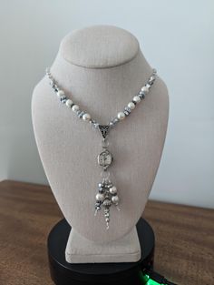 This necklace has a vintage (non-working) Elgin watch marked 10K RGP. The watch is strung with pearl, silver, hematite and crystal beads which also dangle from the watch. The silver tone chain is dotted with faux pearls to complete the look. Given the age of the components, there will be scratches and scuffs on the watches and crystals, but I think that just adds to the vintage look...a real stunner! This necklace is 17" long. The pendent portion is 3.5". These necklaces make a statement and are perfect for anyone who loves vintage or steampunk style. Wear one on its own for a simple and elegant look, or pair with one of my bracelets and earrings to create a bold and eye catching outfit. Add a touch of time-worn charm to your jewelry collection! **I welcome custom orders! If you have somet Elgin Watch, Sundance Style, Steampunk Style, Crystal Wedding, Steampunk Fashion, Upcycled Vintage, Style Necklace, Silver Pearls, Vintage Watches