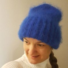 Fluffy mohair hat for women king blue Fluffy volumetric cap electric blue color Winter accessories womenMaterial: 25% Mohair - 24% Wool - 51% AcrylicColor: blue  (king blue/electric blue color)Size: one size fist most.Bright, soft and flufly, they are all connected with love and wrapped .Fit caps free, it does not press his head and leaves no stripes on the forehead.The product can be performed in any color. Leave a message, for special order.... do not hesitate to contact me...Care instructions Trendy Warm Blue Hats, Blue Winter Beanie Cap, Blue Warm Beanie One Size, Warm Blue Beanie One Size, Warm Blue Hats For Winter, Blue Winter Hats One Size Fits All, Blue Beanie Hat For Winter, Blue One Size Beanie Hat, Warm Blue Beanie Hat