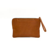 The Grab and Go Clutch is the perfect solution for an on-the-run, fast-paced lifestyle. With two outside pockets for your phone and keys, all you need is to toss in your essentials and you're ready for the busy day ahead!Handcrafted in full-grain leather and solid brass hardware with outside flat pockets, zipper closure, and inside zipper pocket with a built-in wallet.Ways To Wear Use it as a wallet or a clutch The perfect size for an iPad mini, cell phone, keys, and 6 credit cards. Details Zipp Functional Brown Pouch For Everyday Use, Functional Brown Pouch For On-the-go, Versatile Brown Pouch For Everyday Use, Brown Pouch With Cell Phone Pocket For Everyday Carry, Modern Brown Everyday Cases, Modern Brown Cases For Everyday Use, Functional Brown Everyday Cases, Modern Wallet With Cell Phone Pocket For On-the-go, Modern Everyday Clutch Wallet