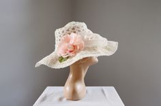 "Description and Measurements: Off white floppy sunhat with two big flowers on it. 5\" wide band, fits a 21-22\" head. Tag: No label Condition: Excellent Follow along on instagram @lovecharlesvintage" Vintage White Fedora Hat, Handmade White Wide Brim Sun Hat, Handmade Flower Hats For Summer, Bohemian White Sun Hat For Garden Party, Retro White Sun Hat For Beach, Retro White Sun Hat For The Beach, Vintage Pink Sun Hat For The Beach, White Summer Hat For Kentucky Derby, White Floral Shaped Sun Hat For Summer