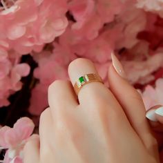 This 14K gold ring showcases a stunning emerald framed by sparkling diamonds, set in a modern geometric multi-band design. A unique piece that combines contemporary style with classic sophistication, it's perfect for daily wear or special occasions. A thoughtful gift for the woman who loves elegance. ❤️ All products are made with love, labor and care. They bring you the best wishes. 🎁 All products are sent in special packages.  👋 You can write to us for any question you have in mind. Questions Modern Green Diamond Promise Ring, Modern Diamond Ring For May Birthstone, Modern Green Diamond Anniversary Ring, Modern May Birthstone Diamond Ring, Modern Green Diamond Wedding Ring, Modern Green Diamond Rings, Modern Gold Emerald Ring With Diamond, Modern Green Emerald Ring For Anniversary, Modern May Birthstone Ring