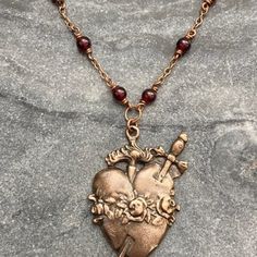 Sacred Heart Necklace Catholic Solid Bronze Pearls and Garnets - Etsy Spiritual Heart-shaped Brass Jewelry, Heart-shaped Spiritual Brass Jewelry, Silver Heart-shaped Copper Jewelry, Copper Heart Pendant For Jewelry Making, Heart-shaped Silver Copper Jewelry, Handmade Heart-shaped Copper Necklaces, Bronze Heart-shaped Necklace For Valentine's Day, Bronze Heart Necklaces For Valentine's Day, Handmade Brass Heart Pendant Jewelry