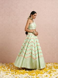 Featuring a one shoulder embroidered mint green blouse with gota and colourblocks. It is paired with a mint green embroidered lehenga and comes with a peach embroidered silk organza dupatta. Color: Mint Green and Peach Fabric: Lehenga & Blouse - Silk base Dupatta - Silk Organza Note: The product will be shipped within 30-35 days of order placed Wash care - Dry Clean Only. Do not use heavy Iron Mint Green Blouse, Mint Green Blouses, Peach Fabric, Blouse Silk, Embroidered Lehenga, Lehenga Blouse, Silk Lehenga, Organza Dupatta, Silk Organza