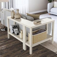 a living room with white furniture and wood flooring