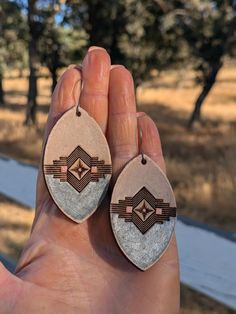 Artisan leather earrings Featuring hand tooled designs that have been slowly hand painted and finished with an antique sealer The ear wires were also made by hand, and feature a hammered texture Absolutely One of a Kind! You'll get the exact earrings in the photo Slowly handmade in the mountains of California Fast and free shipping on every order! Tooled Leather Earrings, Leather Artisan, Leather Crafts, Hand Tooled Leather, Tooled Leather, In The Mountains, Leather Earrings, Leather Tooling, Leather Jewelry