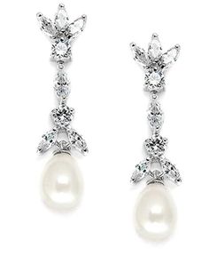 two pairs of earrings with pearls and cubicles on the bottom, one in white gold