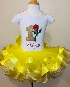 "Yellow & Gold Double Ribbon Trim Tutu This is a super cute tutu! You can purchase the tutu individually or add a top. Please put the name you would like on the bodysuit or shirt in the notes to seller at checkout. When washing please wash it inside out. I recommend hand washing the tutu. Please check out our shop for more items. Have any questions? Feel free to click that \"contact\" button. We will get back to you as soon as possible." White Fitted Tutu Dress With Short Sleeves, White Fitted Short Sleeve Tutu Dress, White Fitted Short-sleeve Tutu Dress, Princess Style Fitted Tutu Dress With Short Sleeves, Fitted Tulle Tutu Dress With Short Sleeves, Princess Style Short Sleeve Fitted Tutu Dress, Yellow Fitted Princess Tutu Dress, Cute Fitted Tutu Dress For Birthday, White Fitted Tutu Dress For Birthday