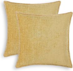 two yellow pillows on white background