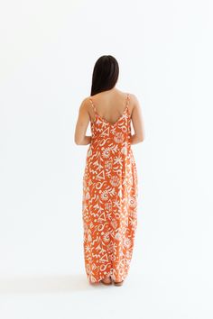 Step into summer with our Villa Maxi Dress, featuring a flowy, relaxed fit and a chic cocoon silhouette. This fun summer dress has adjustable straps and convenient pockets, making it both stylish and functional. The gorgeous tropical fabric makes it perfect for any vacation getaway or a day out by the beach! Malibu Collection FIT Easy Flowy Fit Adjustable Straps Cocoon Shape V-Neckline Pockets Britt is 5'9 Wearing Size Small SMALL MEDIUM LARGE 55.5" Long 56.5" Long 57.5" Long 17" Wide 18" Wide 1 Summer Beach Maxi Dress With Pockets, Beach Sundress Maxi Dress With Pockets, Orange Vacation Dress With Adjustable Straps, Orange Summer Midi Dress For Vacation, Orange Dress With Adjustable Straps For Vacation, Summer Midi Dress With Adjustable Straps For Vacation, Summer Style Orange Midi Dress For Vacation, Casual Flowy Maxi Dress With Adjustable Straps, Relaxed Fit Unlined Sundress Maxi Dress