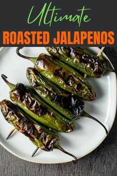 grilled jalapenos on a white plate with the title above it reads ultimate roasted jalapenos