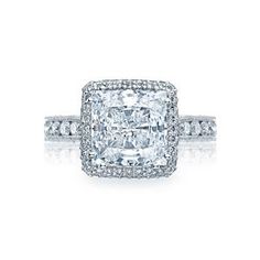 a cushion cut diamond ring with pave set shoulders