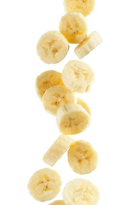 sliced banana slices on a white background