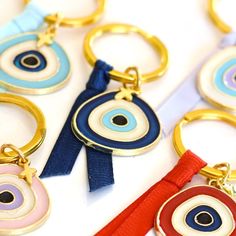 Evil eye Martyrika, Baptism favors for Guests, Greek Orthodox baptism, Christening favors, Mati keychains, These beautiful evil eye keychains are the perfect gift for your guests in any occasion.You can chose from 5 different color combinations, the one that you prefer.The listing is for 10 pieces.If you purchase quantity 1 you get 10 keychains, if you purchase quantity 2 you get 20 keychains etc. FLAT SHIPPING RATES You can chose multiple options or colors or quantity and the shipping will be t Handmade Gold Keychains For Gifts, Handmade Blue Keychain As Gift, Handmade Blue Keychain For Gift, Handmade White Keychains For Personalized Gifts, Handmade White Keychain For Personalized Gift, Greek Orthodox Baptism, Christening Favors, Baptism Favors, Greek Orthodox