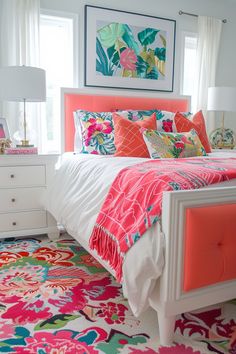 a bedroom with bright colored bedding and colorful rugs