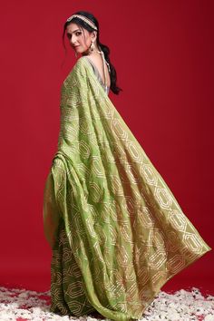 Green saree highlighted with sikkhiya gota patti geometric pattern embroidery. Comes with blouse. 
Component: 2
Embroidered
Sleeve Type: Half
Fabric: Chiffon
Color: Green - Aza Fashions Eid Silk Pre-draped Saree With Gota Work, Eid Georgette Pre-draped Saree With Gota Work, Pista Green Pre-draped Saree With Zari Work For Diwali, Green Pre-draped Saree With Gota Work For Eid, Pista Green Georgette Pre-draped Saree With Dupatta, Festive Pista Green Chanderi Pre-draped Saree, Traditional Cotton Silk Dupatta With Gota Work, Green Chinon Pre-draped Saree For Navratri, Eid Pista Green Pre-draped Saree With Sheer Dupatta