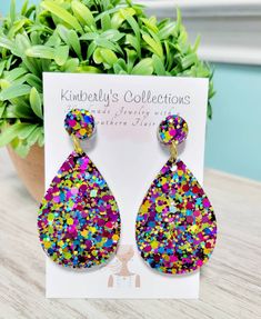 Glitter resin teardrop earrings. Very sparkly in person. Measure 2.25 in from ear. Makes a great gift, will come gift wrapped. Ships free.  Made with stainless steel posts. Multicolor Teardrop Earrings For Party, Multicolor Glitter Drop Earrings, Glitter Teardrop Earrings As Gift, Glitter Teardrop Earrings For Gifts, Sparkling Dangle Teardrop Earrings Gift, Sparkling Teardrop Dangle Earrings As Gift, Multicolor Nickel-free Teardrop Earrings For Gifts, Multicolor Teardrop Earrings For Gift, Handmade Multicolor Teardrop Earrings For Parties