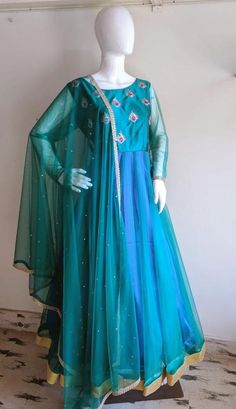 Peacock blue green anarkali with hand embroidery Blue Raw Silk Churidar For Navratri, Green Raw Silk Anarkali Churidar, Green Art Silk Dress With Sheer Dupatta, Blue Raw Silk Anarkali Set With Dori Work, Green Raw Silk Anarkali Set With Dori Work, Green Raw Silk Anarkali Set With Sheer Dupatta, Blue Anarkali Set In Raw Silk, Blue Raw Silk Anarkali Set, Green Gown With Sheer Dupatta For Designer Wear