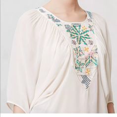 Kashida Dolman From Anthropologie Size S New, With Tags. $178.00 Retail - Style No. 27616440 By Tanvi Kedia Embroidered Neckline Pullover Styling Sheer Rayon Dry Clean Imported Boho, Ethnic Vibe! Necklace Is Not Included Approximate Measurements Are Taken Of Garment Laying Flat/ Unstretched: Bust- Free Size Length (Shoulder To Bottom Hem) 24.5" Bohemian Peasant Top With Embroidered Neckline, Flowy Bohemian Embroidered Top, White Bohemian Blouse With Boho Collar, Bohemian Flowy Embroidered Blouse, Flowy Bohemian Blouse With Floral Embroidery, Flowy Bohemian Blouse With Embroidery, Folk Style Peasant Top For Beach, White Bohemian Embroidered Tunic Top, White Bohemian Peasant Top With Boho Collar