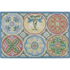 a rug with different colored circles and designs on the front, in various sizes and colors