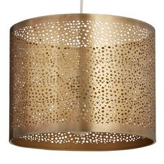 a light that is hanging from the ceiling with holes on it's fabric covering