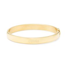 Add a touch of gold to your outfit with this gold plated oval bangle. The bangle is 7.5 inches long  and features a unique oval shape. The gold plated Stainless Steel bracelet can be engraved in two different places. Classic Gold-tone Bangle For Everyday, Classic Matte Gold Bracelet, Classic Gold Name Bracelet With Engraving Option, Gold Cuff Bracelet With Engraving Option, Classic Gold-tone Bangle As Gift, Classic Gold Plated Name Bracelet, Adjustable Gold Bangle With Engraving Option, Elegant Gold Bangle With Engraving Option, Personalized Classic Gold Bangle Bracelet