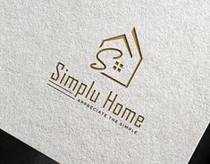 simplu home logo on a white and gold business card with a house in the middle