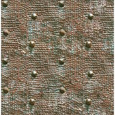 an image of a brown and green textured wallpaper with small circles on it