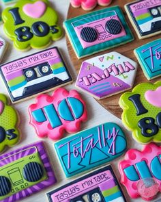 decorated cookies are arranged on a table to spell out the number thirty five and twenty ten