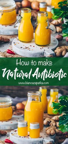 three jars filled with orange juice on top of a table next to nuts and other food